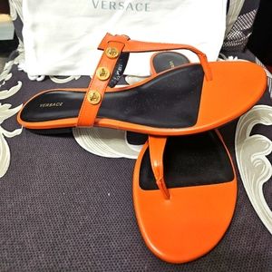 Versace orange leather sandals, flip-flop style. Never used,size 38